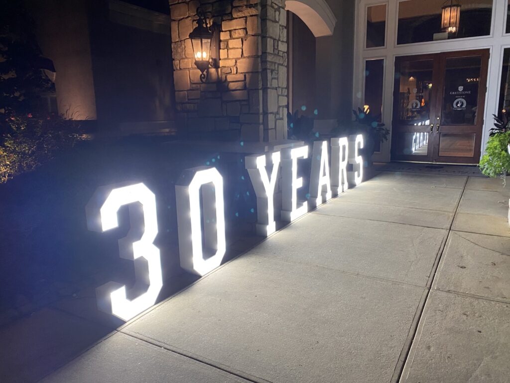 A large sign that says 3 0 years